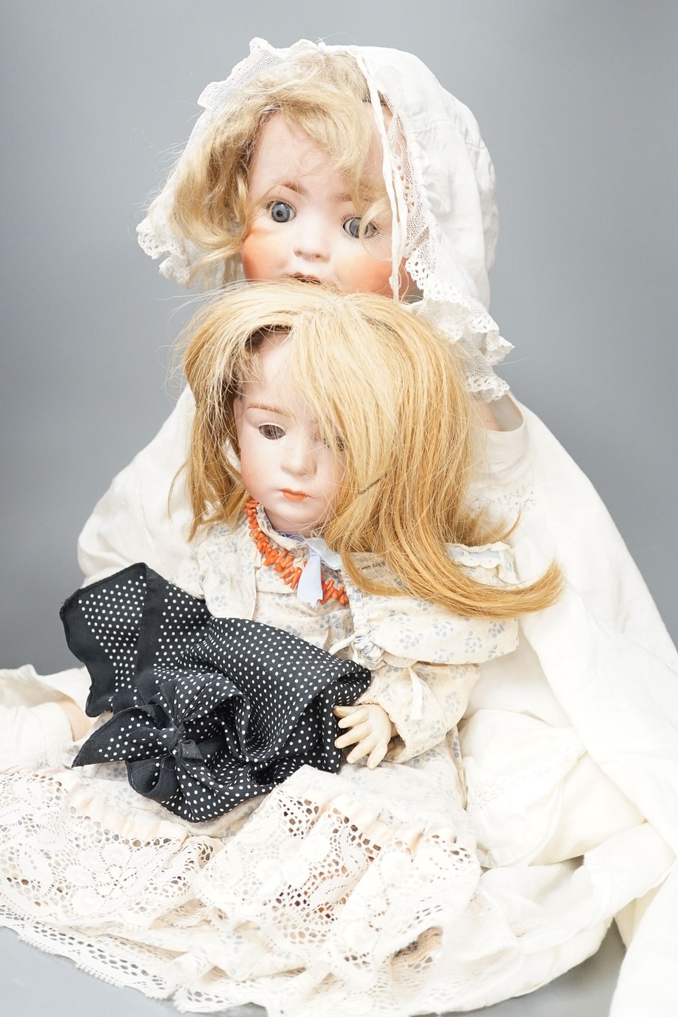 A German Porzellanfabrik Burggrab bisque headed doll, one other bisque headed doll